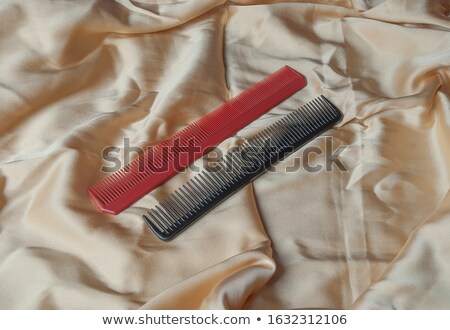 Foto stock: Two Red Massages Comb