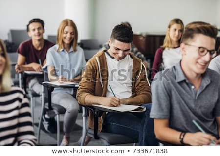 Stockfoto: High School - Young Male Student Write Notes In Classroom