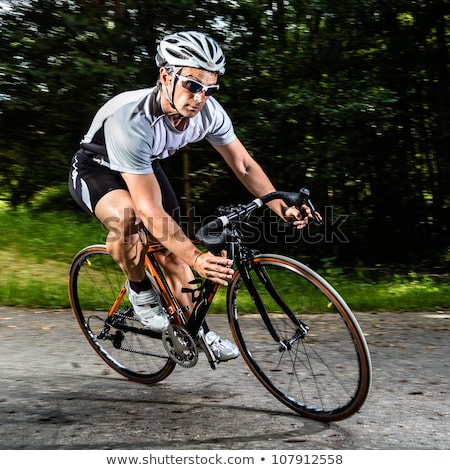 Stock photo: Cyclists In A Curve