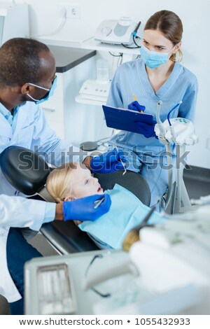 [[stock_photo]]: Female Apprentice Noting Down Appointments