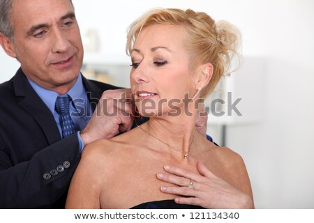 Stock fotó: Couple Preparing To Go Out For Posh Meal