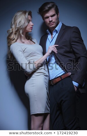 Stok fotoğraf: Woman Is Pulling Her Boyfriend By His Collar