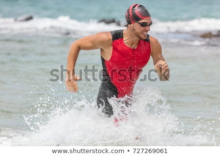 Stock fotó: Triathletes Swim On Start Of The Ironman Triathlon Competition