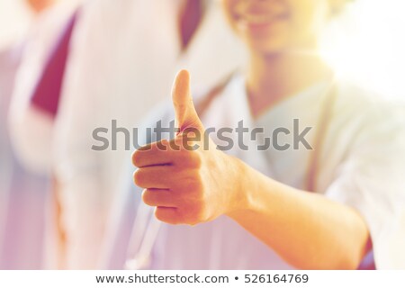 Zdjęcia stock: Smiling Female Doctor Showing Thumbs Up