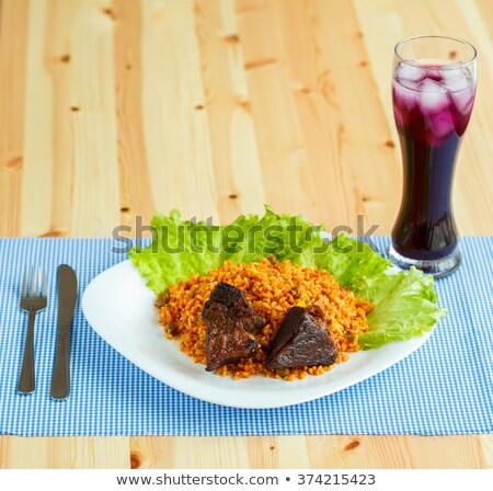 Сток-фото: Tasty Dish Of Roast Beef With Rice And Salad Leaves And A Glass