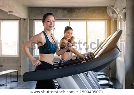 Foto stock: Side View Of A Young Sexy Fitness Woman In Sportswear