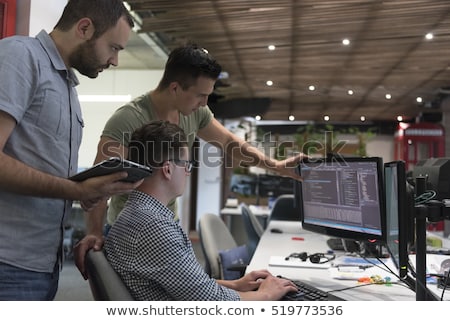 Сток-фото: Software Development On Laptop In Modern Workplace Background