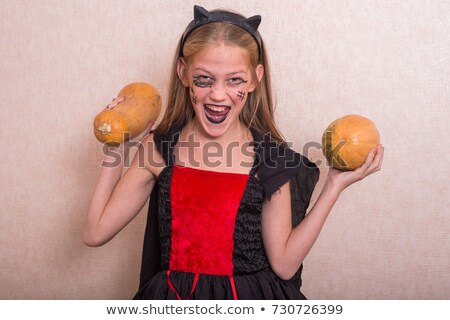 Stok fotoğraf: Emotional Screaming Witch With Pumpkin Looking Camera
