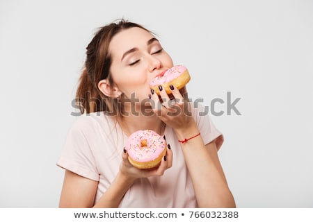 Stock photo: Close Up Of A Young Woman Eating Donut