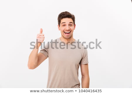 Foto stock: Image Of Attractive Man 30s Having Stubble Showing Thumb Up With