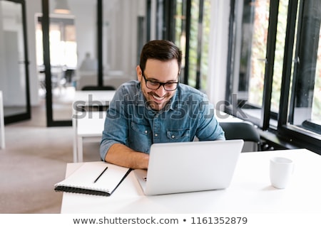 Stock photo: Young Architect With Laptop Smiling