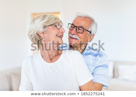Portrait Of An Active Senior Couple Standing And Embracing Each Other At Home Zdjęcia stock © Photoroyalty