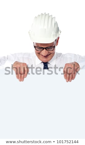 Construction Businessman Holding A Blank Poster Foto stock © stockyimages