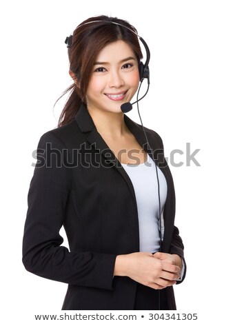 Foto d'archivio: Young Receptionist With Headset And Boss In Background