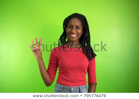 Stock photo: Hand Holding Up The Number Four From The Top