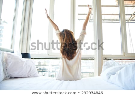Stock photo: Beautiful Woman Is Resting On White Bed