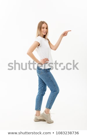 Foto d'archivio: Side Profile Of A Young Woman Showing Something