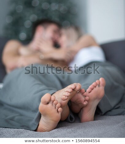 Foto stock: Intimate Young Couple In Bed