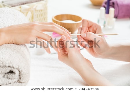 Foto stock: Nail Technician Giving Customer A Manicure