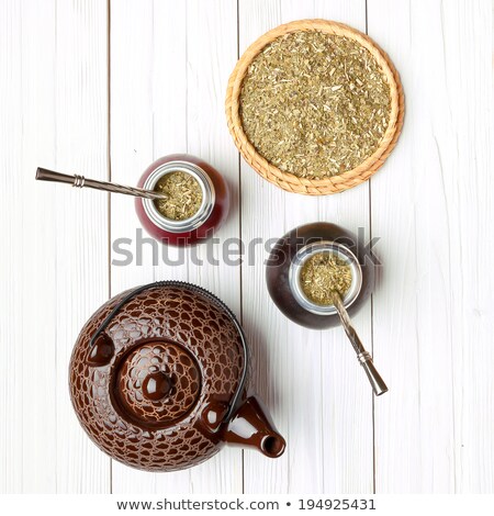 [[stock_photo]]: Bombilla On Top Of A Mate Cup