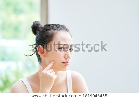 Stok fotoğraf: Beautiful Young Woman Touching Her Face