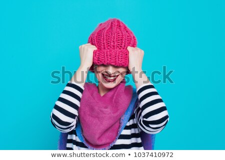 Stock photo: Young Woman Wearing Knit Hat By Wall