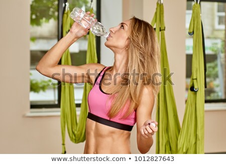 Stok fotoğraf: Aerobic Gym Pilates Woman Rest Drinking Water Bottle
