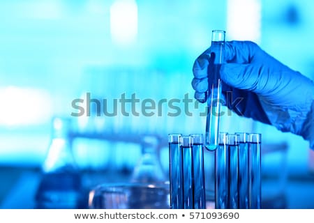 Foto stock: Hand Holding A Test Tube