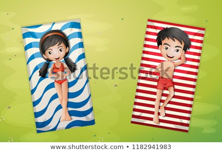 Stockfoto: Boy And Girl Relaxing On Towel Aerial View