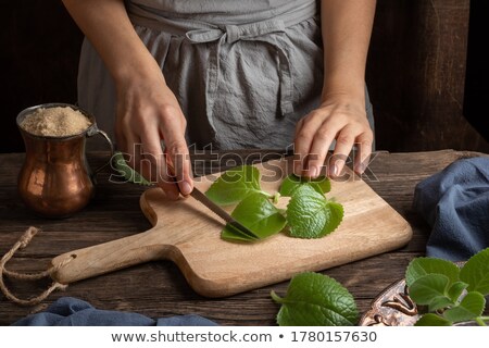 [[stock_photo]]: Preparation Of A Silver Spurflower Syrup From Fresh Silver Spurflower Leaves