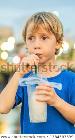 Foto stock: Young Boy Tourist On Walking Street Asian Food Market Vertical Format For Instagram Mobile Story Or