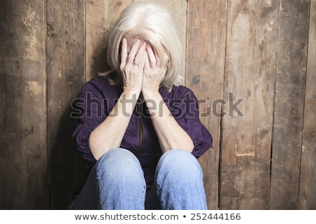 ストックフォト: Depress Senior Person With Wood Background