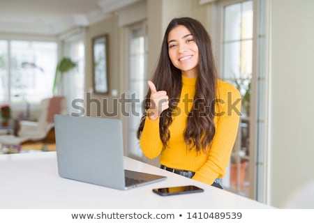 Stok fotoğraf: Young Business Woman Showing Thumb Up Gesture