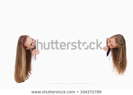 Stok fotoğraf: Smiling Blond Haired Woman Standing Behind A White Board