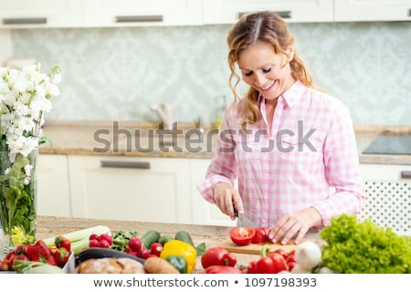 Stock photo: Woman Chopping Vegetables In Kitchen