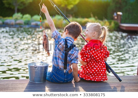 Stock photo: Boy Fishing In The River