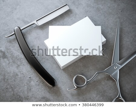 Stok fotoğraf: Razor And Scissors With Stack Of Blank Business Cards