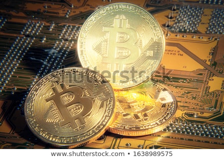 Stok fotoğraf: Bitcoin Lies On The Motherboard