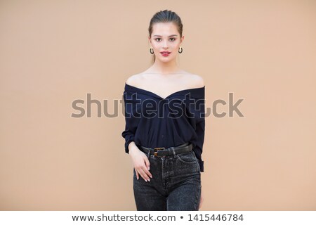 Foto d'archivio: Fashion Model Wearing Navy Blue Blouse On Beige Background