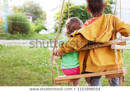 Сток-фото: Brother And Sister Sitting On Swing