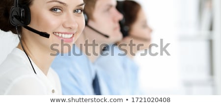 [[stock_photo]]: Telephone Operator Talking On Headphones