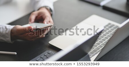 Stockfoto: Businessman Working At Office Desk And Using A Digital Tablet C