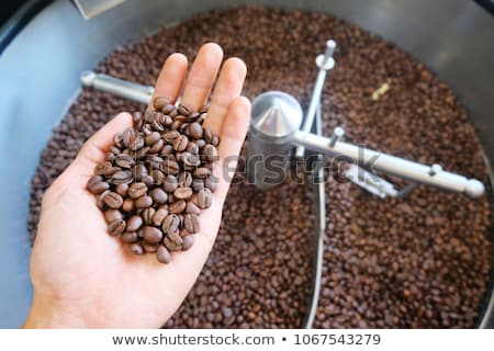 Stock photo: Barista Roasting Coffee With A Machine