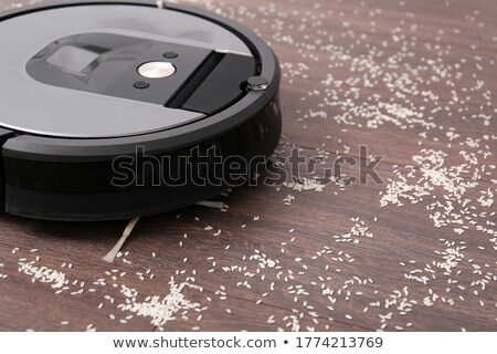 Stock photo: Cleaning Robot Vacuum Cleaner Of Rounded Shape