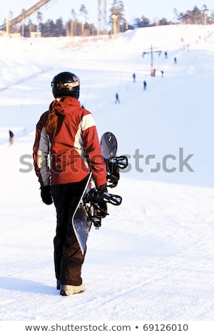 Stockfoto: Female Snowboarder On The Snowhill