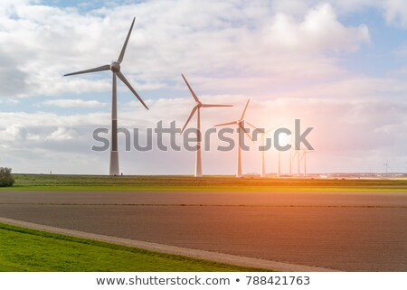 Foto d'archivio: Wind Generator Turbine Over Blue Sky