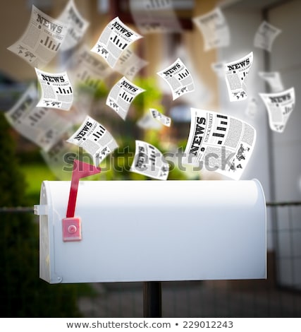 Foto stock: Post Box With Daily Newspapers Flying