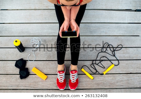 Сток-фото: Woman Relaxing On Sunbed With Smart Phone