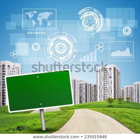 Blank Green Billboard And Tree By Road Running Through Grassy Hills Towards City Stockfoto © cherezoff