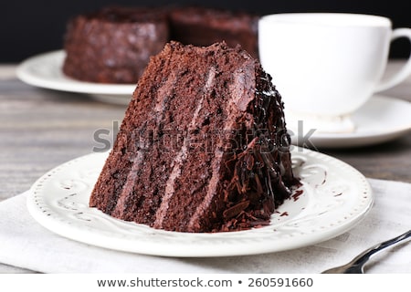 Zdjęcia stock: Piece Of Chocolate Cake On A Plate And Black Coffee